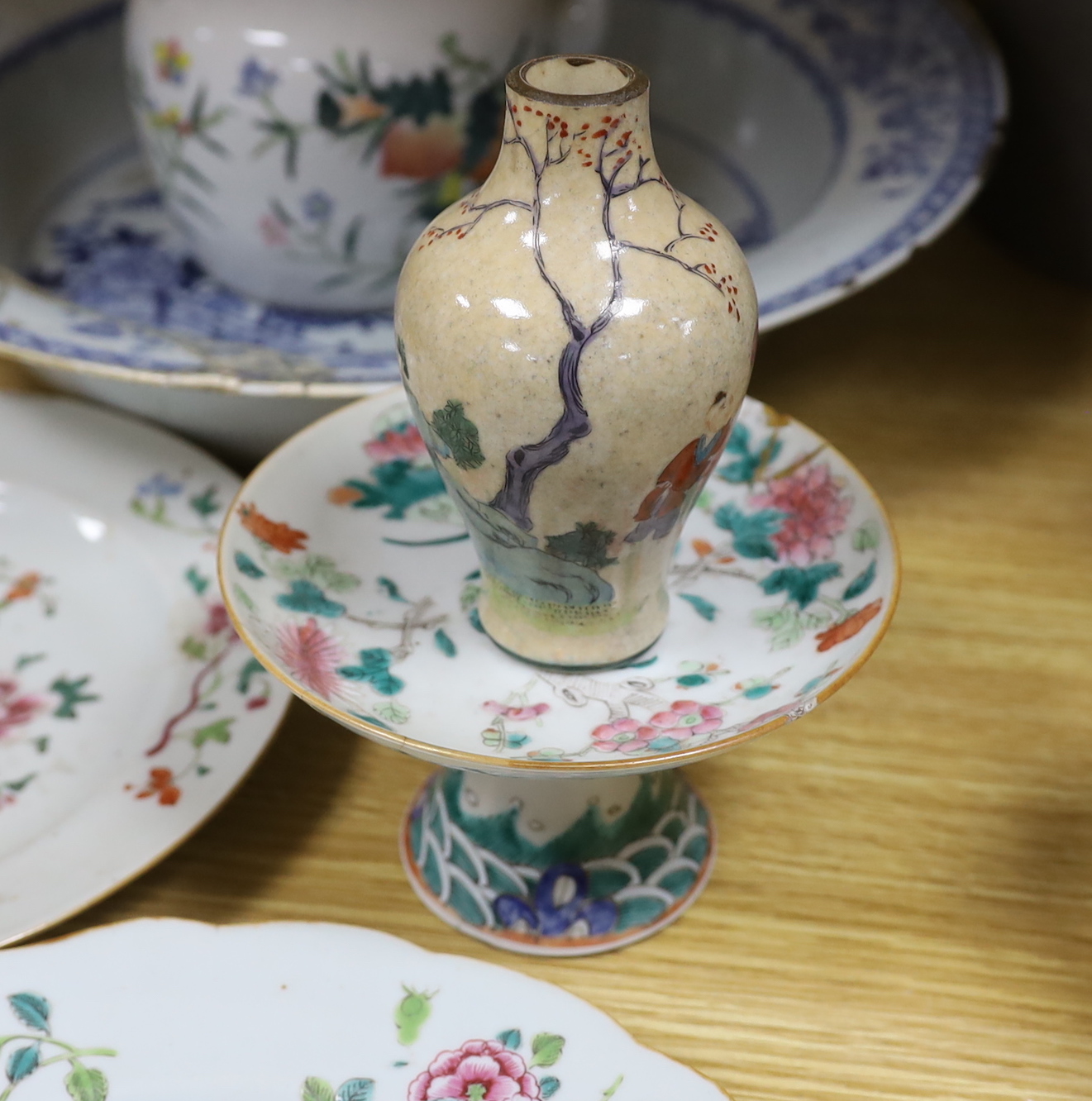 An 18th century Chinese blue and white basin, two plates, and an early 20th century Chinese teapot, footed dish and a vase